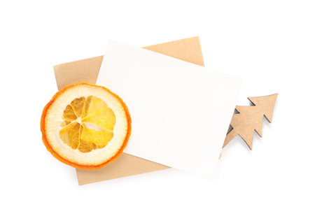 Blank greeting card and Christmas decor on white background, top view. Space for textの写真素材