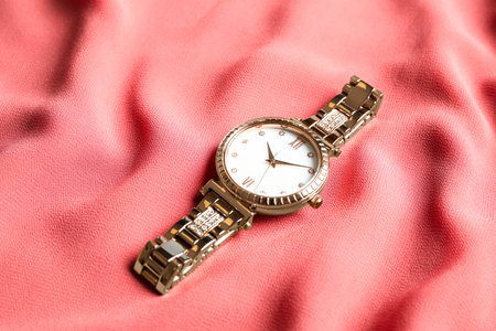 Luxury wrist watch on pink fabric. Fashion accessoryの写真素材