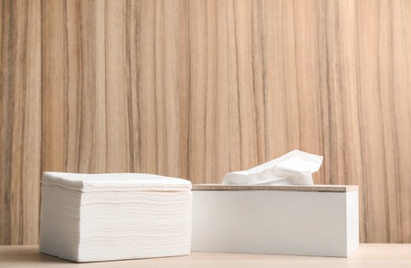 Clean paper tissue on wooden table. Space for textの写真素材