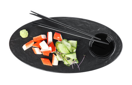 Fresh crab sticks with cucumber and soy sauce on white background, flat layの写真素材