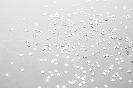 Confetti stars on gray background. christmas celebrationの写真素材