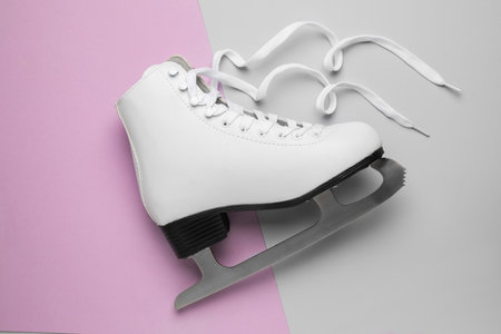 Figure ice skate on color background, top view