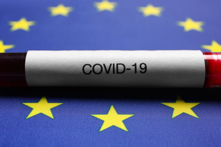 Test tube with blood sample on European Union flag background, closeup. coronavirus outbreakの写真素材