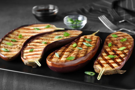 Delicious grilled eggplant halves served on plate, closeupの写真素材