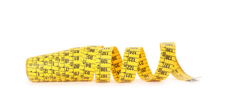 New yellow measuring tape isolated on whiteの写真素材