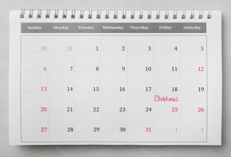 Calendar with word Christmas on gray stone table, top view. holiday count downの写真素材