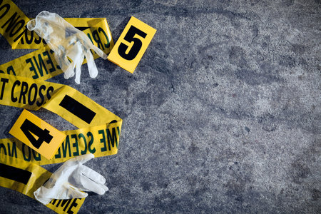 Crime scene markers, tape and gloves on gray stone table, flat lay