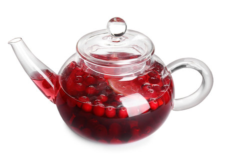 Tasty hot cranberry tea with lemon in teapot isolated on whiteの写真素材