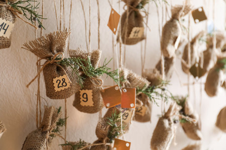 New Year advent calendar hanging on beige wall indoors, closeupの写真素材