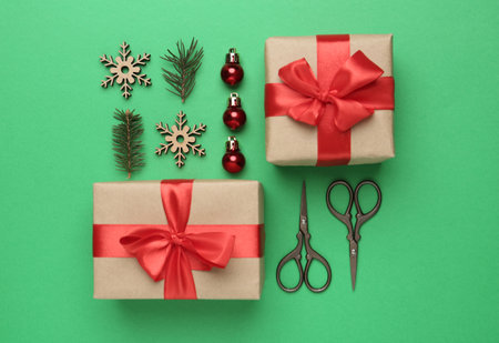 Flat lay composition with Christmas gifts on green background. boxing day
