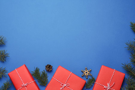 Flat lay composition with Christmas gifts on blue background, space for text. boxing dayの写真素材