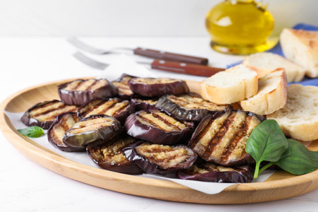 Delicious grilled eggplant slices served on white table, closeupの写真素材
