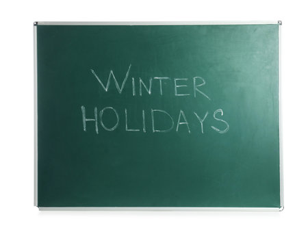 Green chalkboard with text Winter Holidays isolated on whiteの写真素材