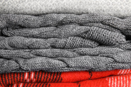 Stack of soft warm plaids as background, closeupの写真素材