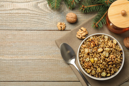Traditional Christmas slavic dish kutia served on wooden table, flat lay. Space for textの写真素材