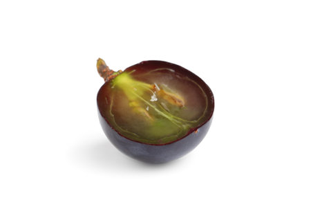 Half of delicious ripe dark blue grape isolated on whiteの写真素材