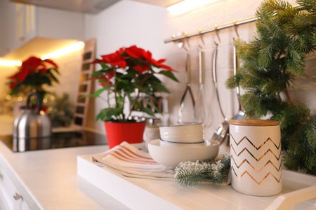 Set of kitchenware and Christmas decor on countertop indoorsの写真素材