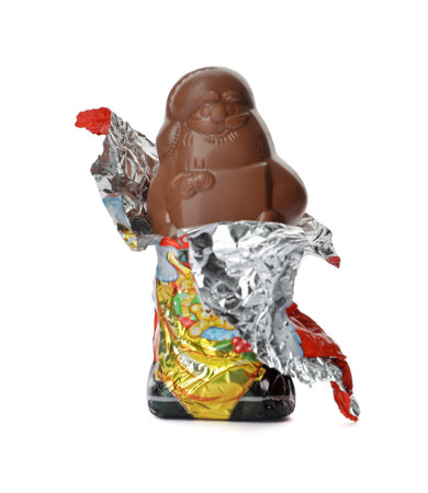 Unwrapped chocolate Santa Claus isolated on whiteの写真素材
