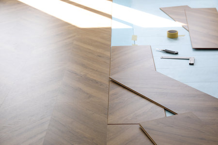 Installation of laminated wooden floor at homeの写真素材