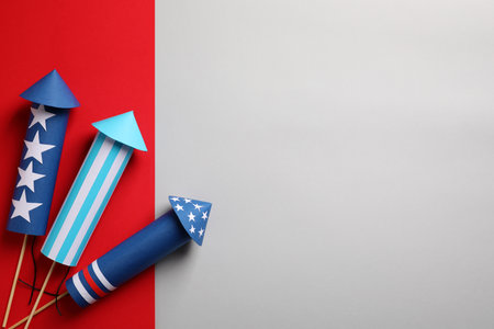 Firework rockets on color background, flat lay with space for text. Festive decorの写真素材