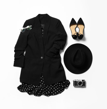 Flat lay composition with stylish black dress on white backgroundの写真素材