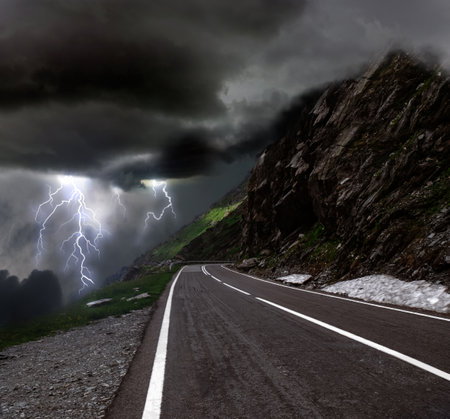 Dark cloudy sky with lightning. picturesque thunderstorm in the mountains