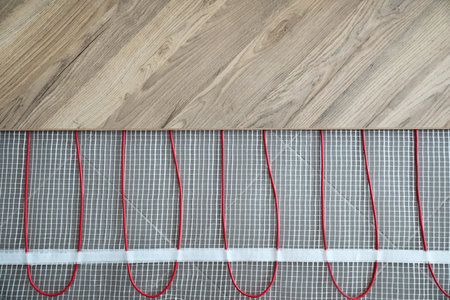Installation of modern underfloor trace heating system indoors, top viewの写真素材