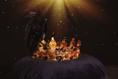 fantasy world. Black crow lit by magic light sitting on golden crownの写真素材