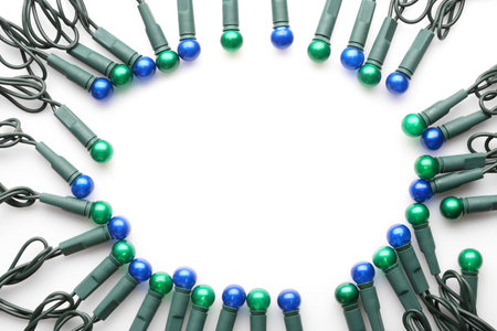 Frame of Christmas lights on white background, top viewの写真素材