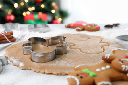 Making homemade Christmas cookies. Dough for gingerbread man on white table, closeupの写真素材