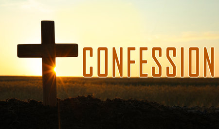 Word Confession near silhouette of Christian cross outdoors at sunriseの写真素材