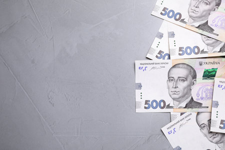 Ukrainian money on grey background, flat lay. Space for textの写真素材