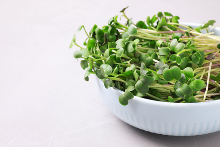 Fresh organic microgreens on white table, closeupの写真素材