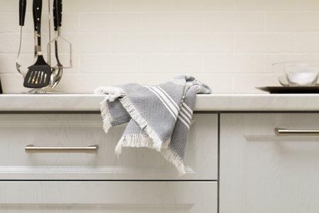 Clean kitchen towel on counter at homeの写真素材