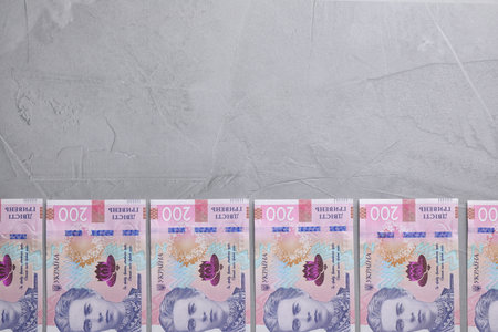 Ukrainian money on grey background, flat lay. Space for textの写真素材