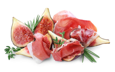 Delicious ripe figs, prosciutto and herbs on white backgroundの写真素材