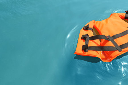 Orange life jacket floating in the sea. emergency rescue equipment