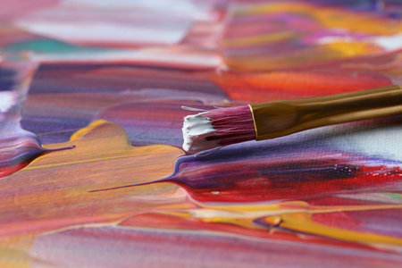 Brush on abstract colorful paint, closeup viewの写真素材