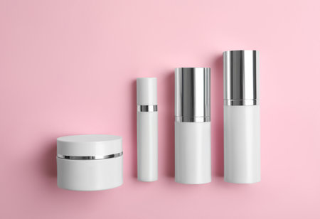 Set of luxury cosmetic products on pink background, flat layの写真素材