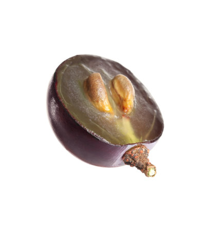 Half of delicious ripe dark blue grape isolated on whiteの写真素材