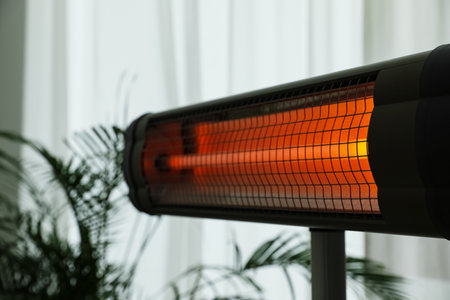 Modern electric infrared heater in room, closeupの写真素材