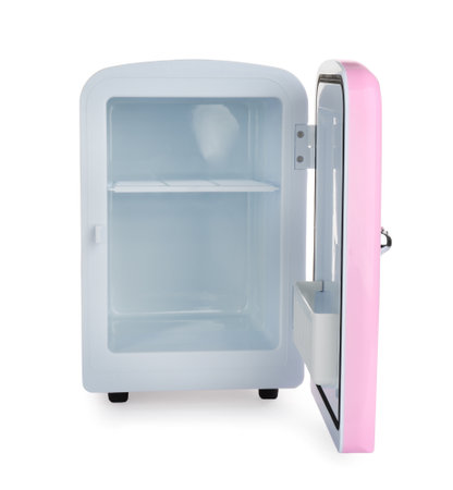 Open pink cosmetics refrigerator isolated on whiteの写真素材