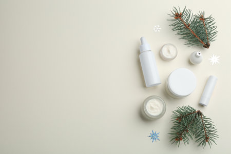 Flat lay composition with different cosmetic products on beige background, space for text. winter careの写真素材