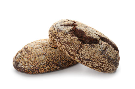 Loaves of delicious fresh bread on white backgroundの写真素材