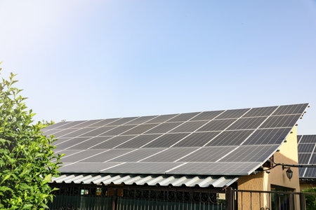 House with installed solar panels on roof. alternative energy sources