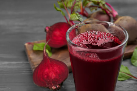 Fresh beet juice and raw vegetable on table, closeupの写真素材