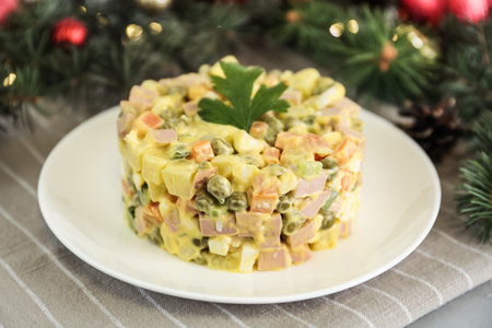 Traditional russian salad Olivier served on light table, closeupの写真素材