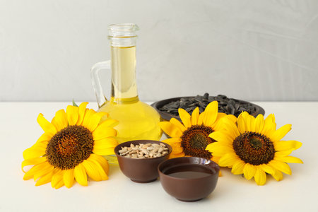 Composition with sunflower oil on white tableの写真素材
