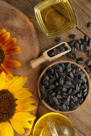 Flat lay composition with sunflower oil on wooden tableの写真素材