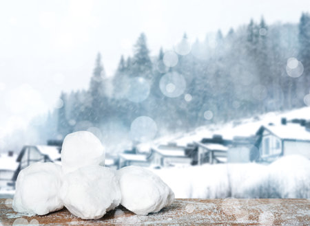 Snowballs against blurred mountain forest. Winter outdoor activitiesの写真素材
